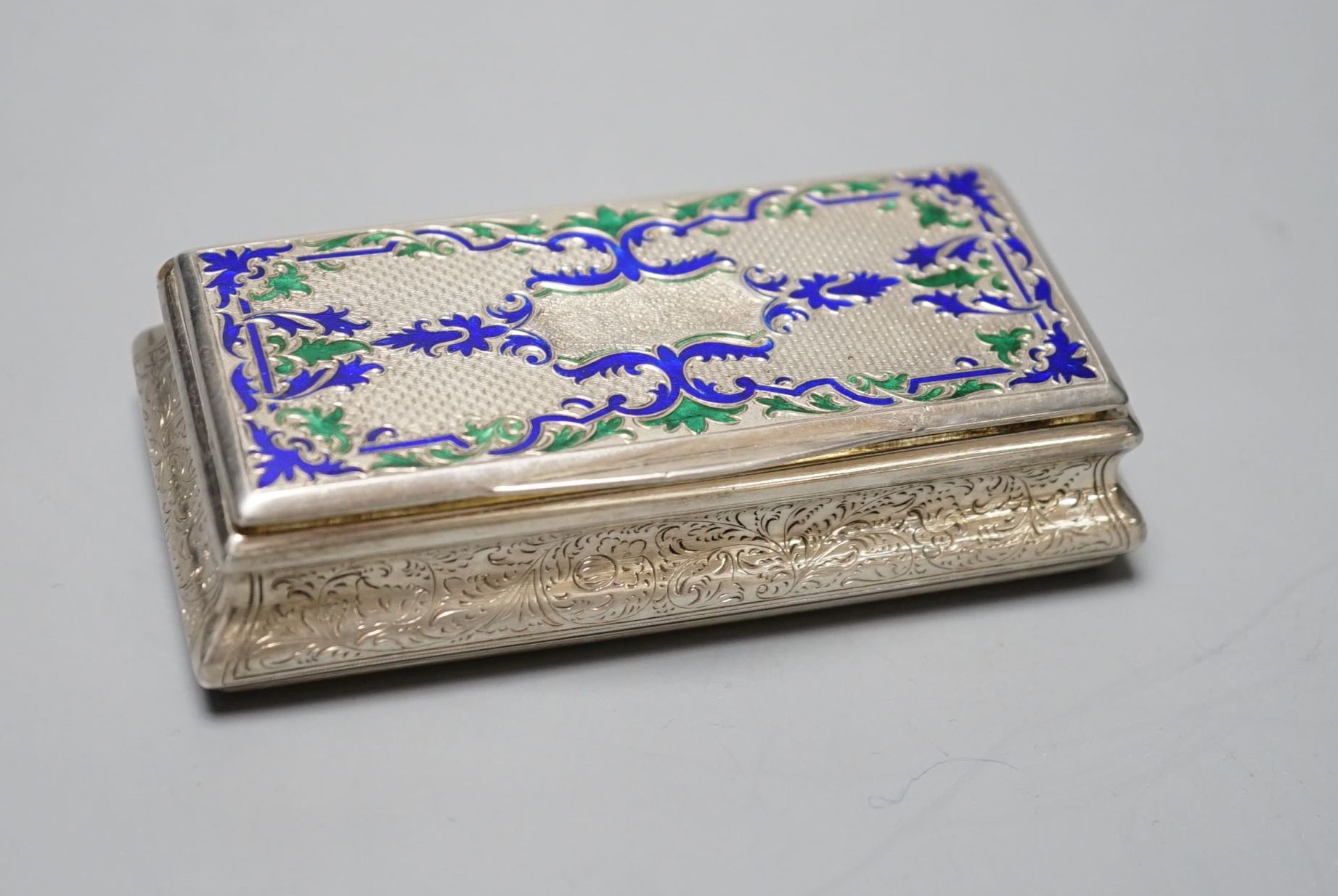 A 19th century Austro-Hungarian white metal and two colour enamel snuff box, with interior engraved inscription, 92mm, gross weight 98.2 grams.
